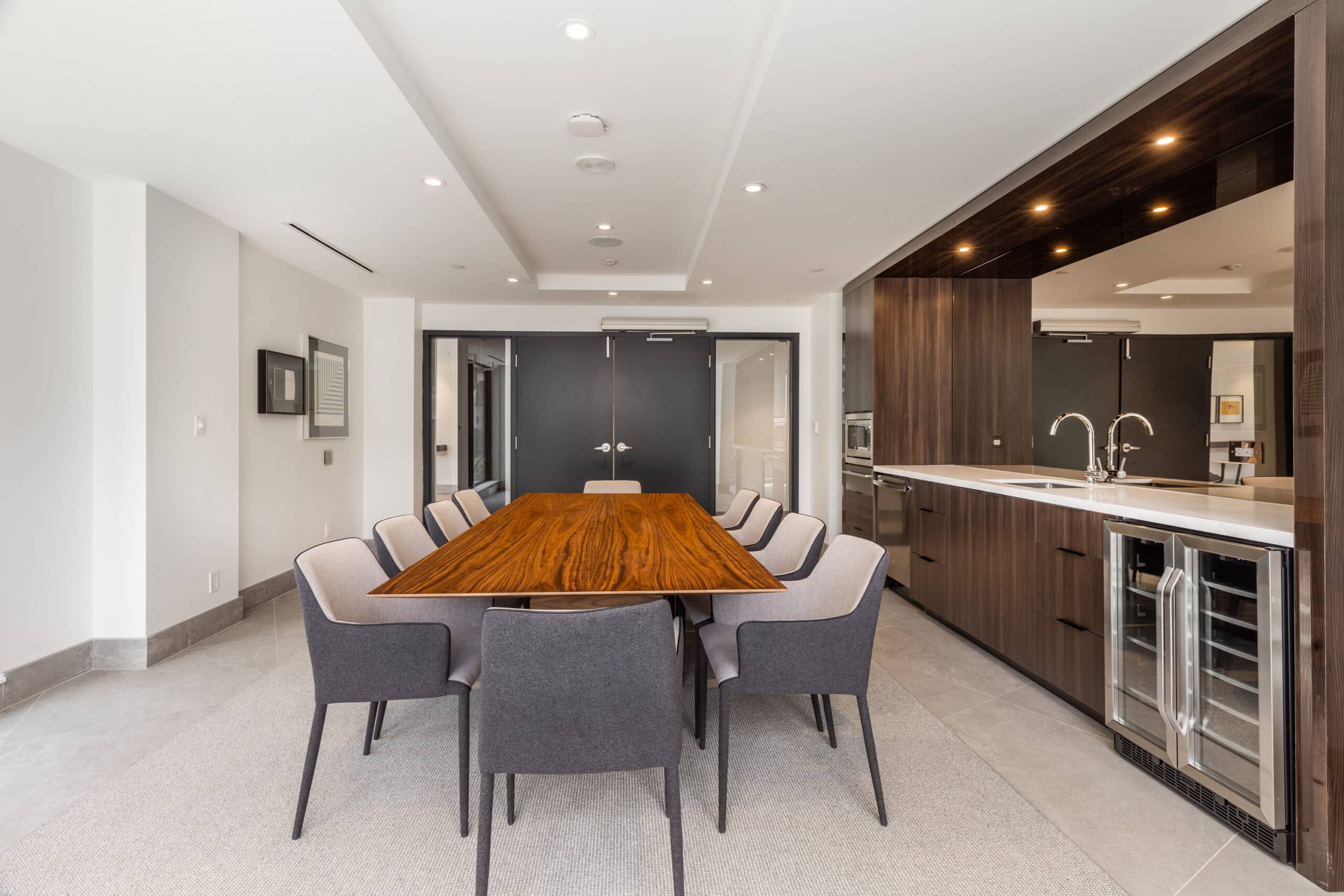 Remote-work friendly co-working space and private dining room featuring a modern kitchenette at our luxury apartments in Midtown Toronto.