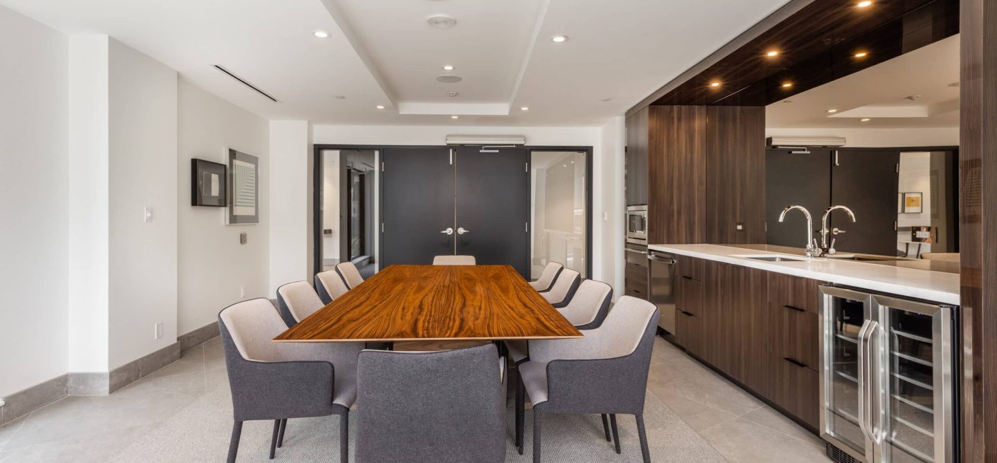 Remote-work friendly co-working space and private dining room featuring a modern kitchenette at our luxury apartments in Midtown Toronto.