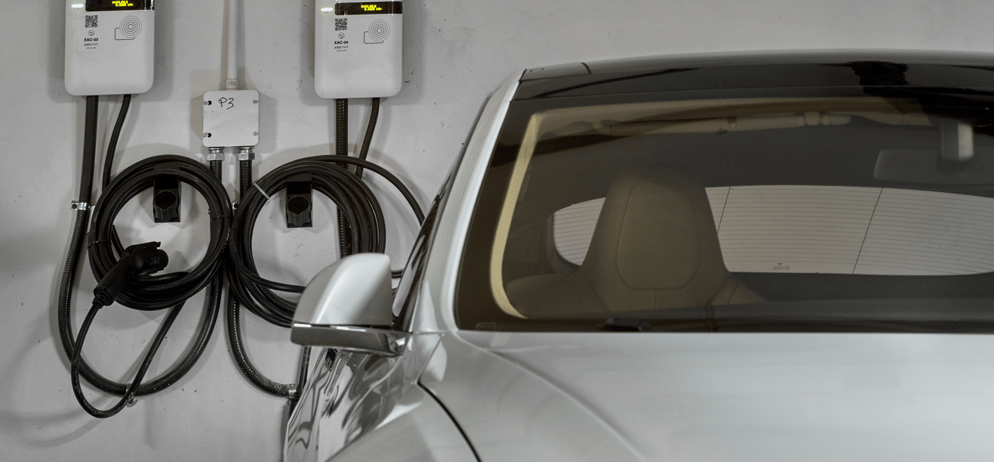 Dedicated electric vehicle charging station in the secure resident parking garage at The Whitney on Redpath, promoting sustainable luxury living in Toronto.